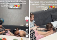 "Әкесінен көргенін қайталайды": Желіде қазақстандықтар немерелеріне аяғын сүйгізген әженің әрекетін айыптады
